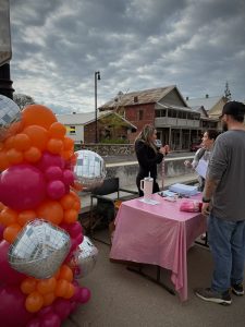 spring fling woman with gift booth