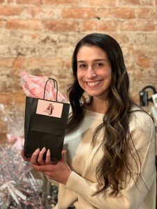 spring fling woman with gift bag